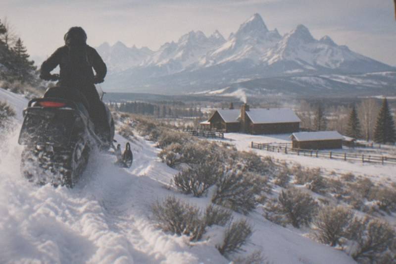 Snowmobiles on a Heart Six guided ride through snowy Jackson Hole backcountry